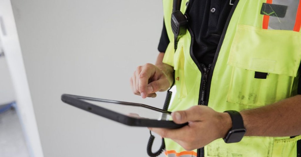 construction worker using tablet.